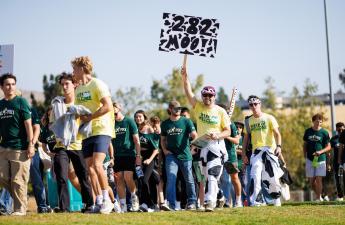 The WOW group leaders of 282 walk with their new students during the WOW grouping. 