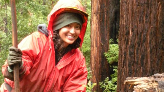 Student planting a tree