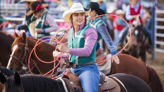 Cal Poly student on a horse at the rodeo