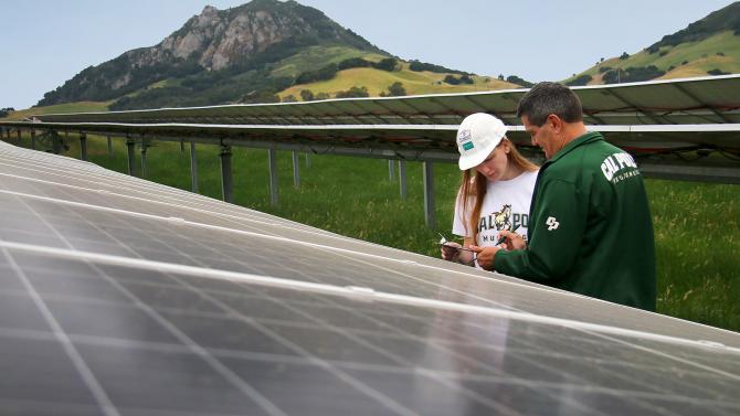 Student and professor in solar fields