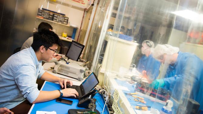 Students working on cubesat