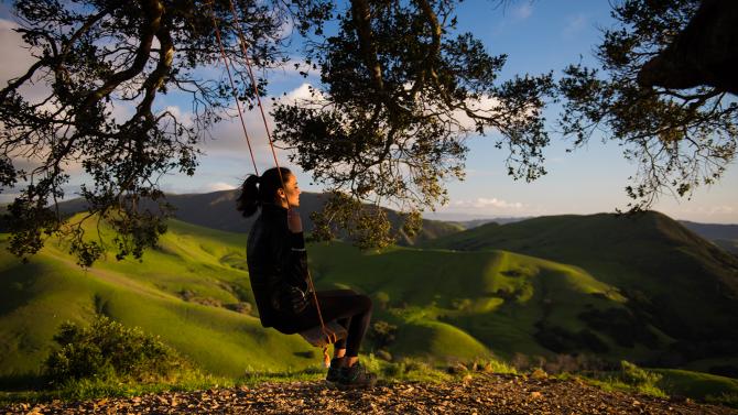 Woman swinging on Serenity Swing