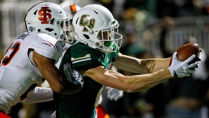 Football player catching the ball during a game. 