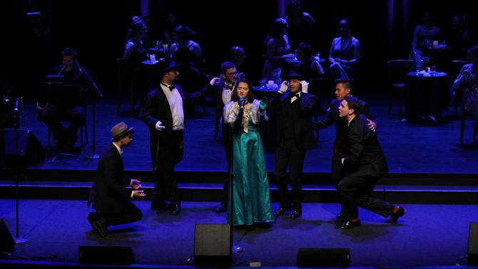 Student production of an Opera with theatrical lighting and sound on stage.