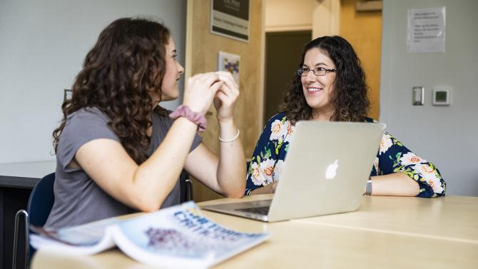 Dr. Lauren Kolodziejski meets with a student