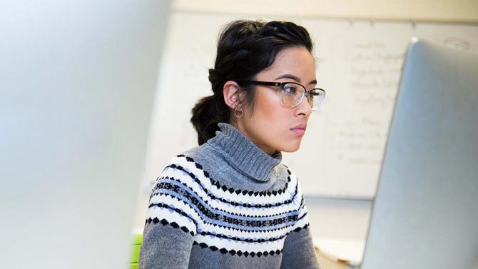 student studies infront of computer