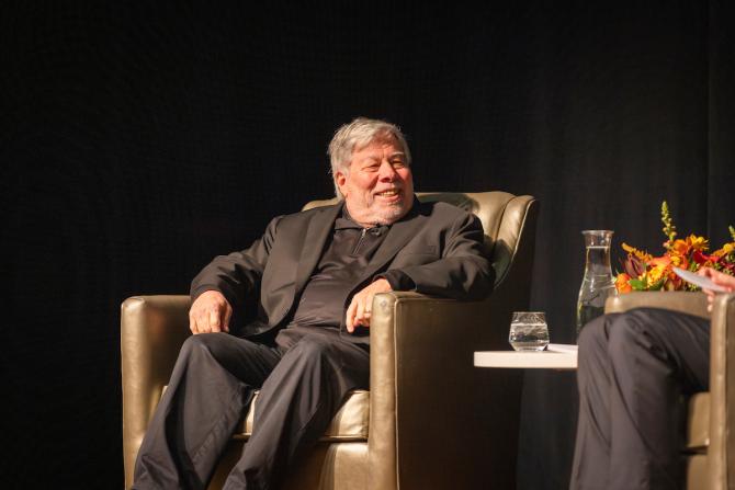 Steve Wozniak sits in an armchair onstage at the PAC during his talk. 