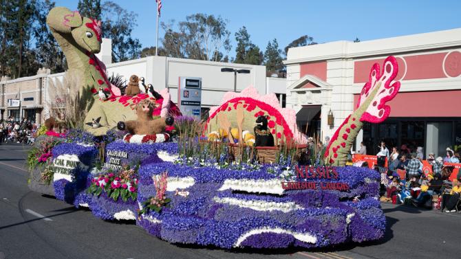 The Cal Poly 2025 Rose Parade float featuring the Loch Ness Monster drives down a street